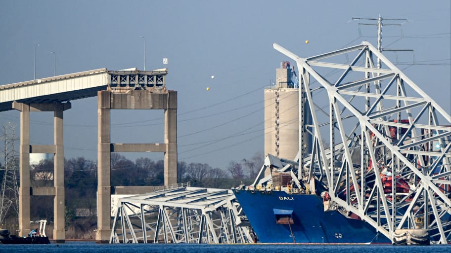 "he collapsed Francis Scott Key Bridge lies on top of the container ship Dali in Baltimore, Maryland, on March 29, 2024, as clean-up work begins.