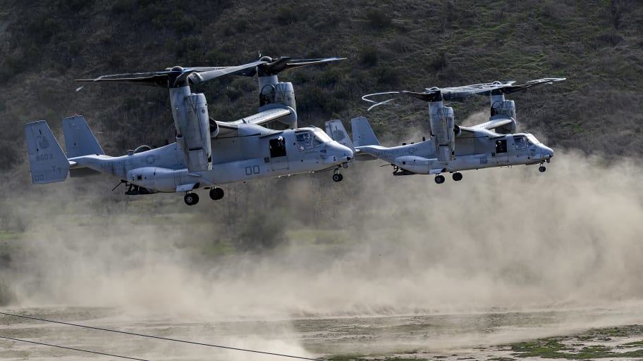 A couple MV-22 Osprey aircraft kick up dust while landing during the annual Steel Knight training exercise at Camp Pendleton.