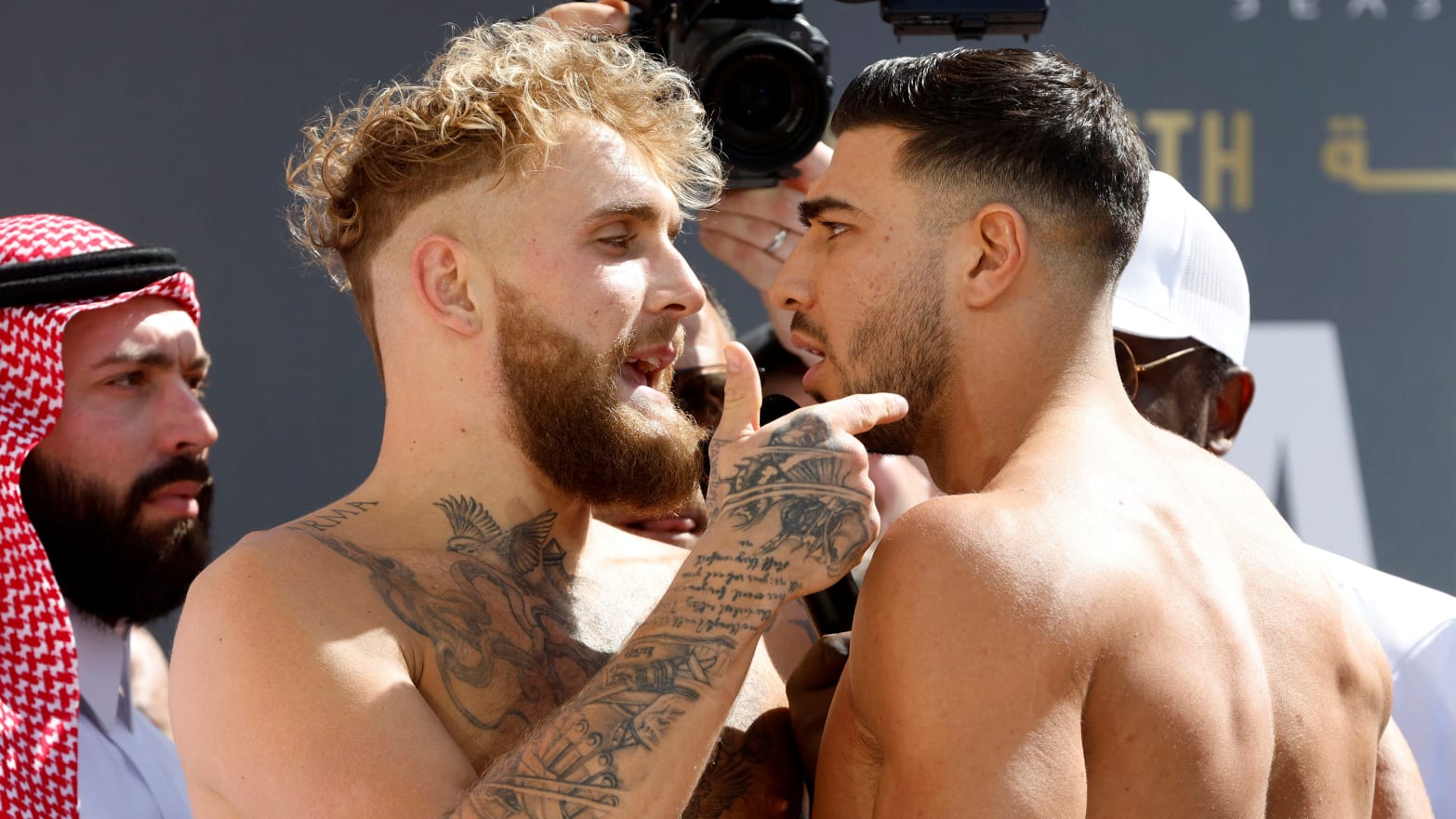 Jake Paul clashes with Tommy Fury during the weigh-in