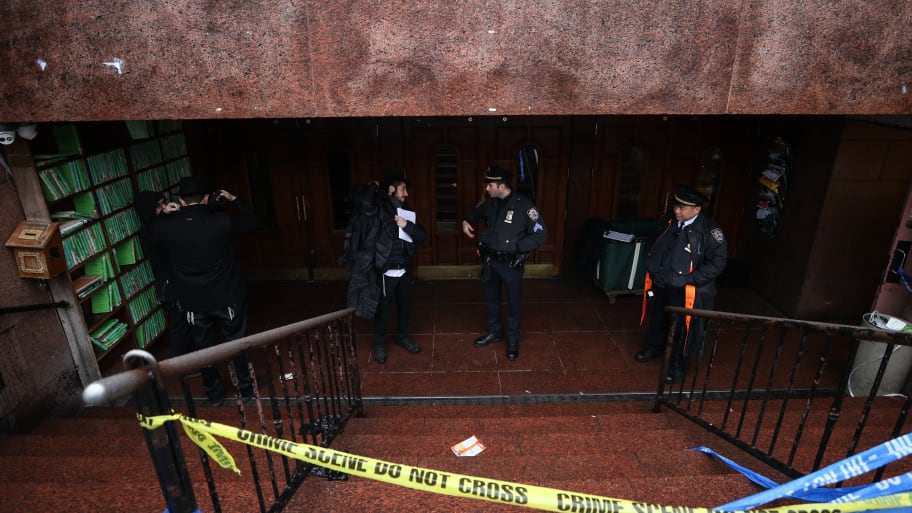 Police officers respond to the Chabad-Lubavitch World Headquarters 