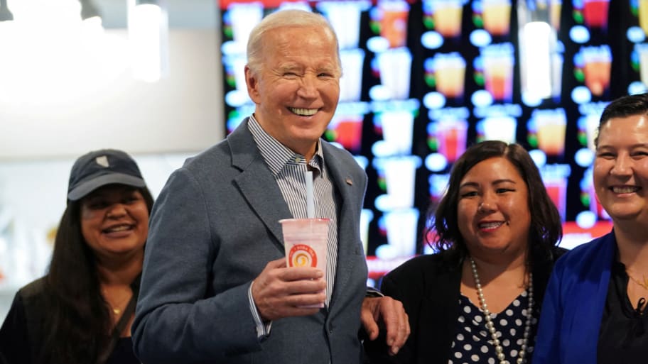 U.S. President Joe Biden poses for photos during a visit to a boba tea shop in Las Vegas, Nevada, U.S., February 5, 2024. 