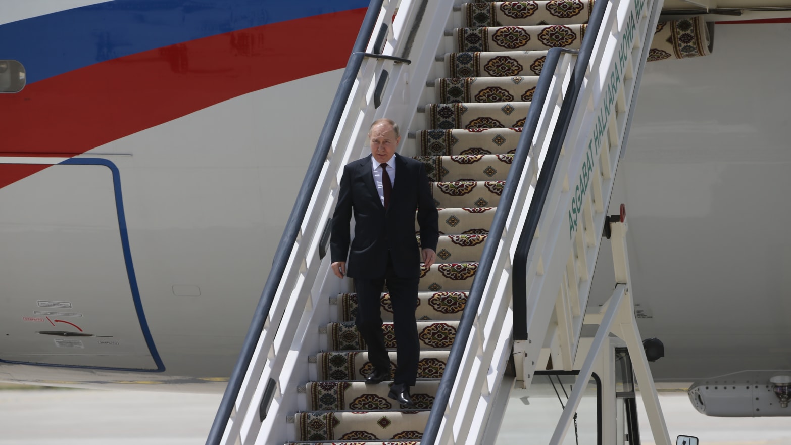 Russian President Vladimir Putin leaves his presidential plane during the arrival ceremony at the Ashgabat International Airport on June 29, 2022 in Ashgabat, Turkmenistan.