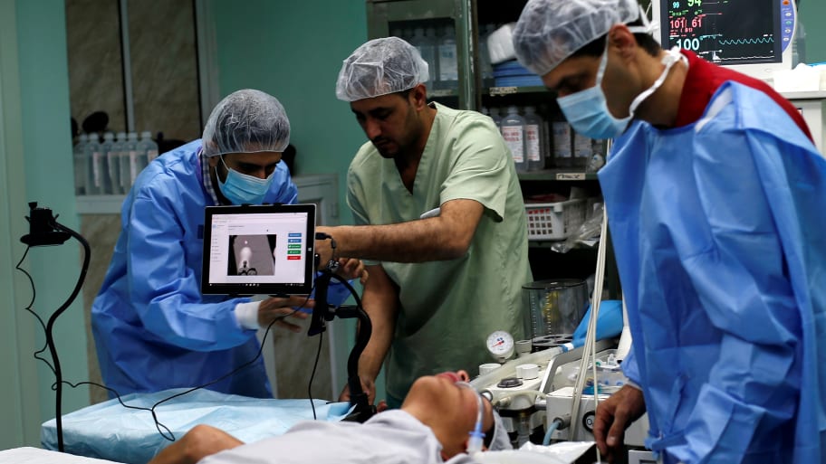 Palestinian surgeon Hafez Abu Khousa in the operating room at Al Awda Hospital in the northern Gaza Strip