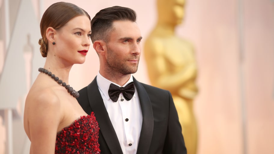 Recording artist Adam Levine (R) and Behati Prinsloo attend the 87th Annual Academy Awards at Hollywood & Highland Center on February 22, 2015 in Hollywood, California.
