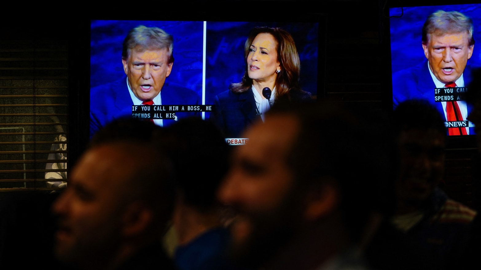 People watch the presidential debate between Republican presidential nominee Donald Trump and Democratic presidential nominee Kamala Harris at a watch party in New York City on September 10, 2024.