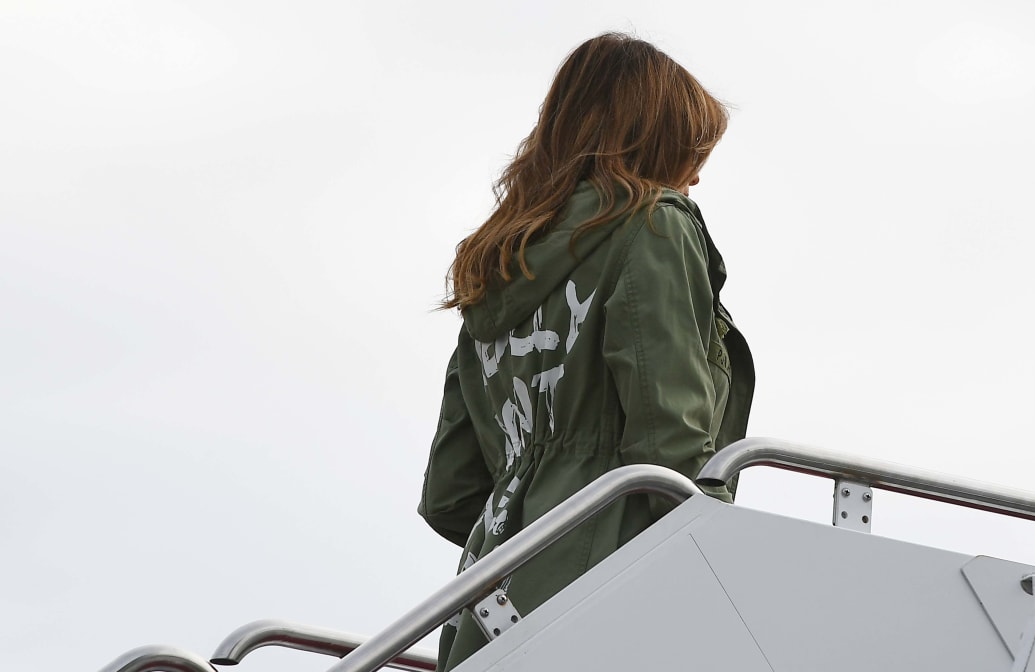 Melania Trump boards a flight at Andrews Air Force Base in Maryland on June 21, 2018 wearing a rain jacket that reads, ‘I Really Don’t Care. Do U?’