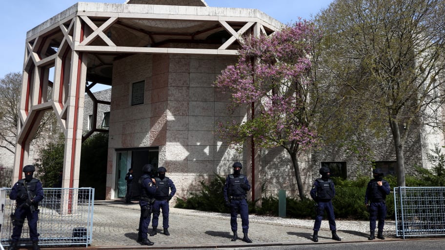 Police officers stand guard outside Ismaili Centre, after a deadly knife attack in Lisbon, Portugal, March 28, 2023.