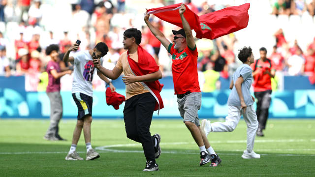 Morocco fans invading the pitch