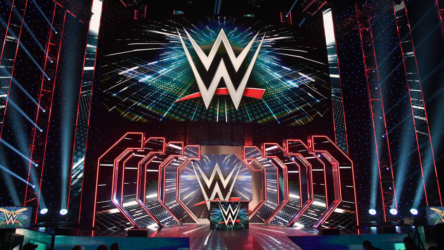 WWE logos are shown on screens before a WWE news conference at T-Mobile Arena on October 11, 2019