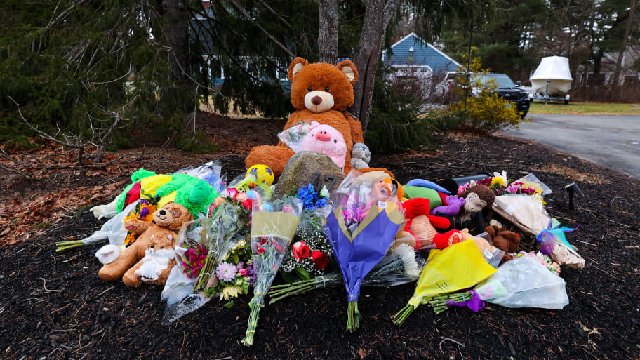 A memorial outside Lindsay Clancy's home, with stuffed bears and flowers.