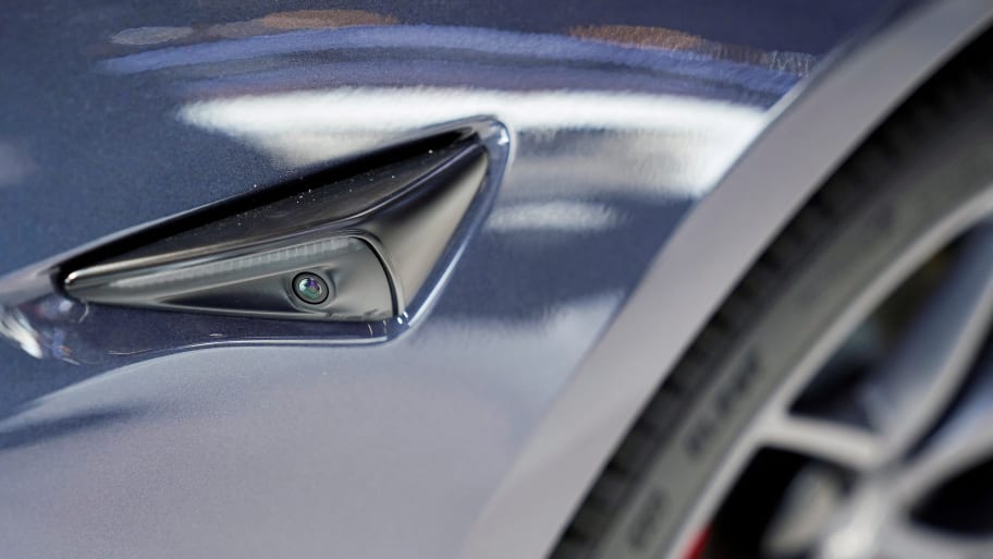 A camera is seen on the body of a Tesla electric vehicle (EV) during a media day for the Auto Shanghai show in Shanghai, China, April 20, 2021.