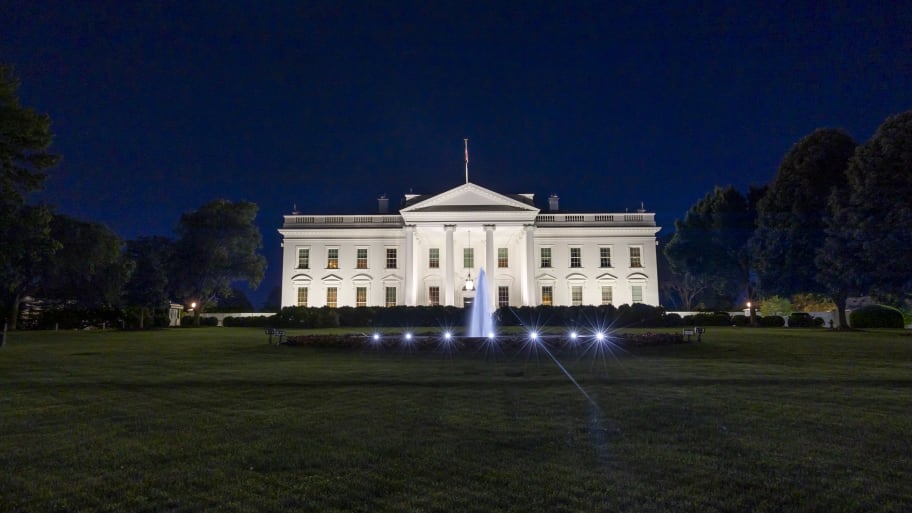 Exterior view of the Northern side of the White House illuminated during the night in Washington DC.