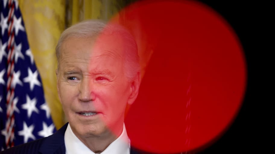 Framed by television camera lights, U.S. President Joe Biden