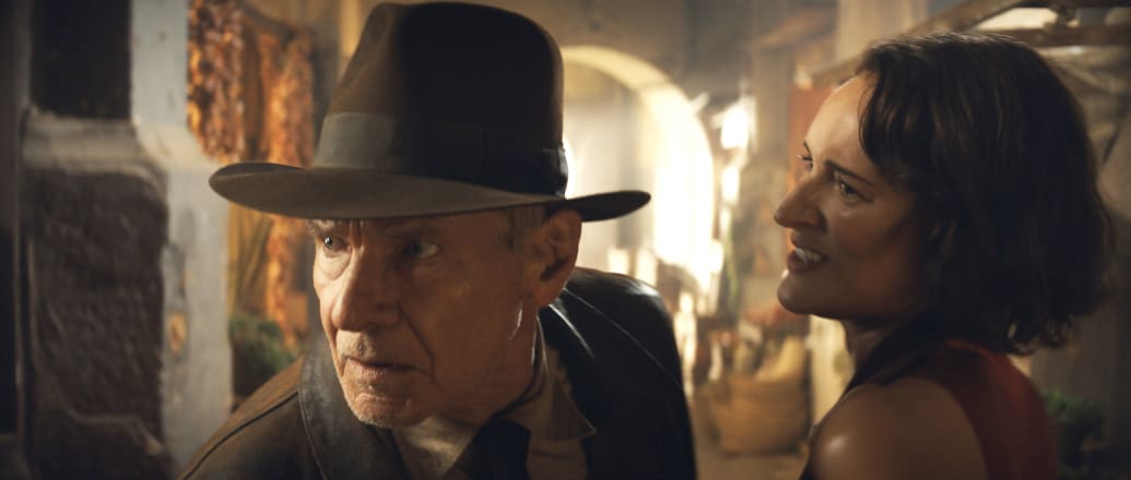 A still from Indiana Jones and the Dial of Destiny showing Harrison Ford as Indiana Jones and Phoebe Waller-Bridge as Helena.