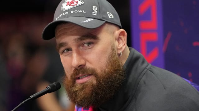 Kansas City Chiefs tight end Travis Kelce (87) talks to the media during Super Bowl LVIII Opening Night. 