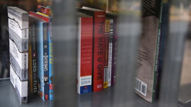 A Little Free Library, which was designed to look like a prison, invites residents to take books that the library says have been challenged by schools across the state of Texas, in Houston, Texas.