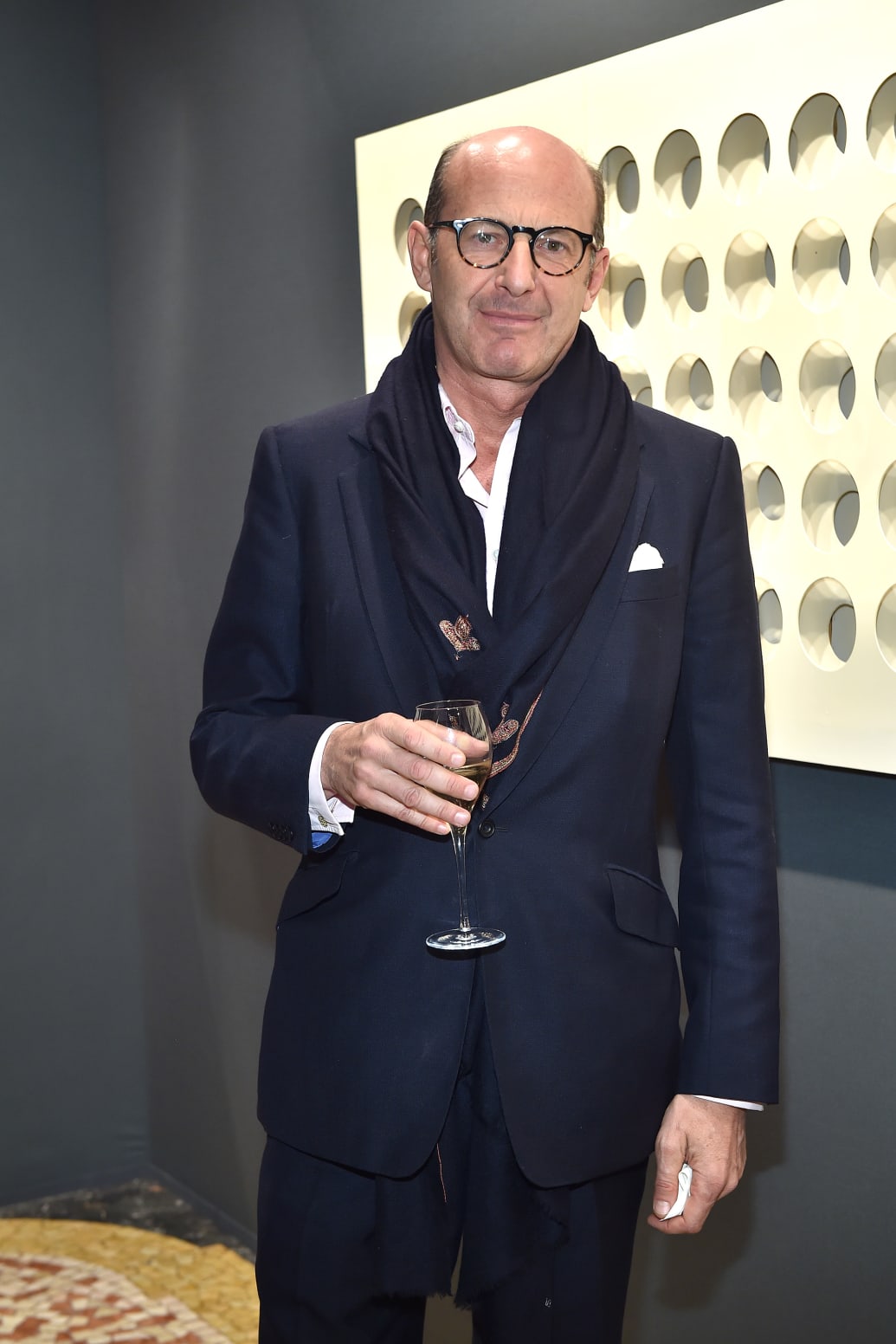 A 2015 photo of Marco Voena at a private dinner and preview, holding a cocktail.