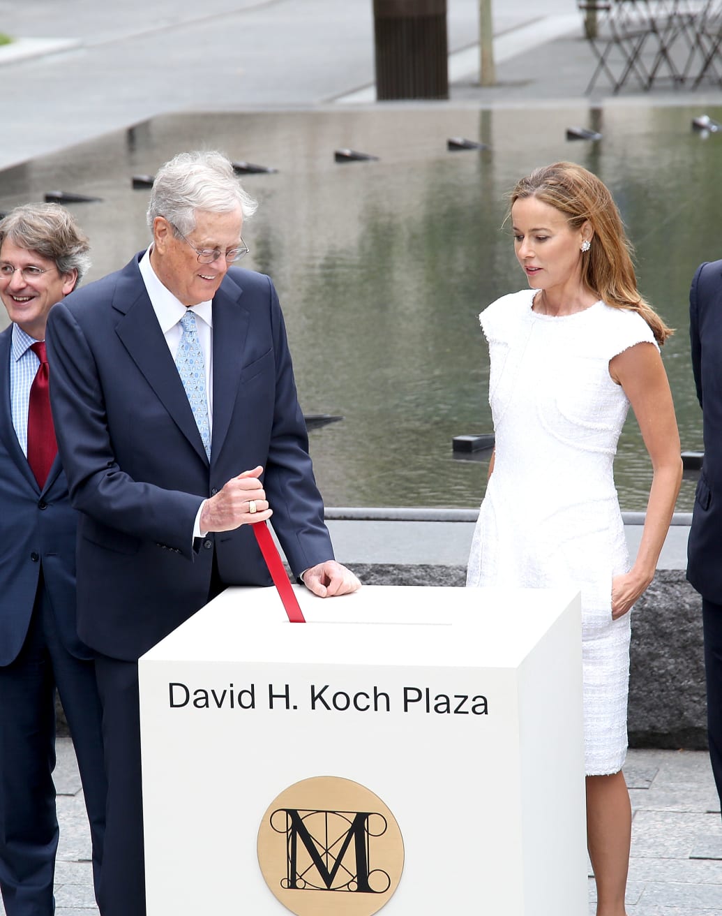 David H. Koch and Julia Koch attend the unveiling of the David H. Koch Plaza at the Metropolitan Museum of Art in 2014. 