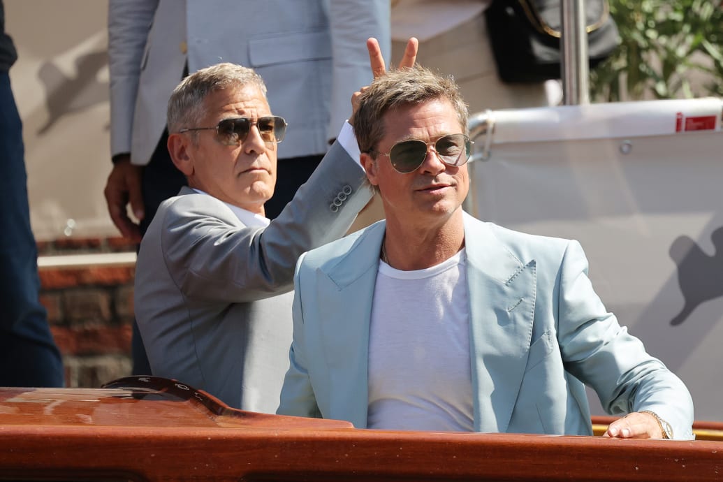 A photo of George Clooney and Brad Pitt arriving at the Venice Film Festival