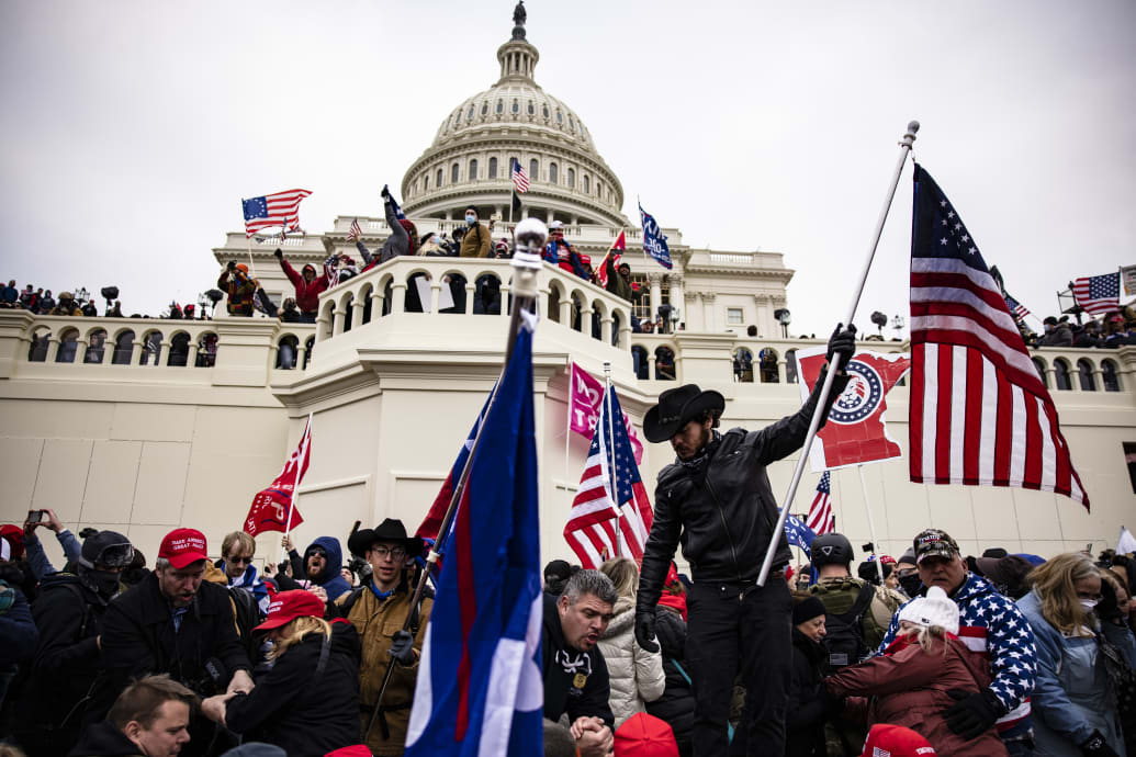 A photo including Pro-Trump Supporters at the U.S Capitol Building