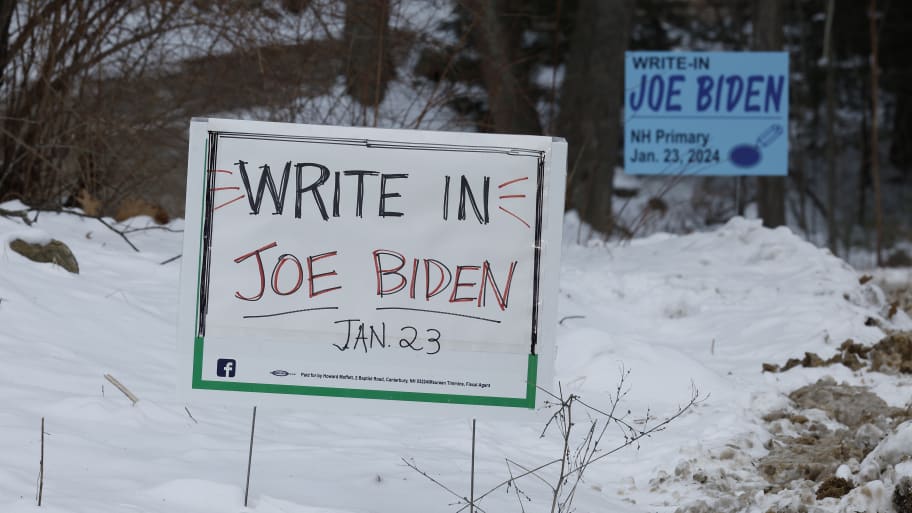 Campaign signs asking voters to write in President Joe Biden in Tuesday's Republican primary election.