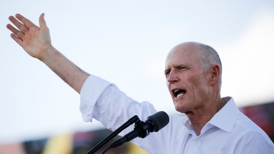 Sen. Rick Scott is warning communists and socialists not to travel to his “free” state of Florida.