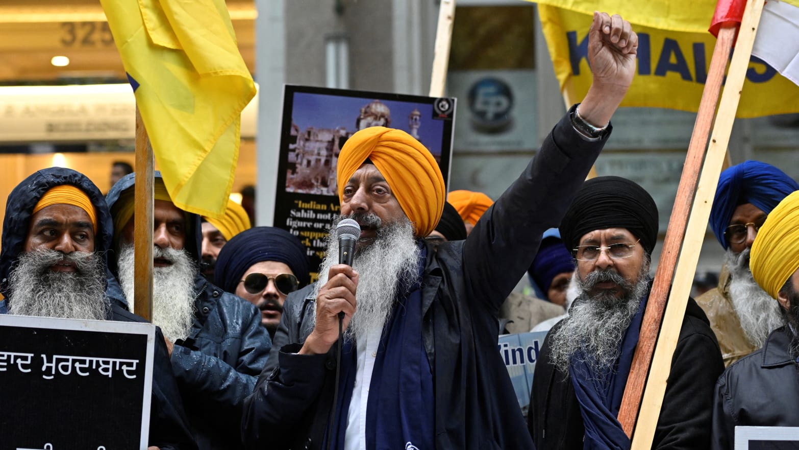 Demonstrators advocating for the creation of Khalistan rally in the street.