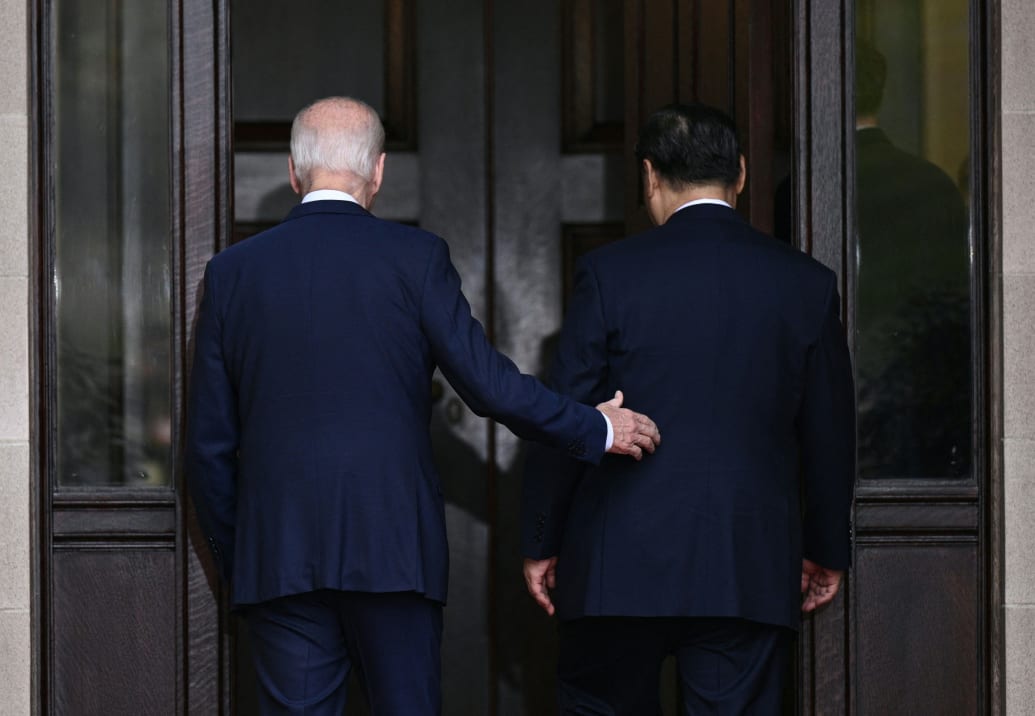 A photograph of US President Joe Biden and Chinese President Xi Jinping arriving for a meeting during the Asia-Pacific Economic Cooperation (APEC) Leaders' week.