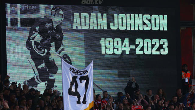 Memorial to Matt Johnson plays on a screen at a soccer game.