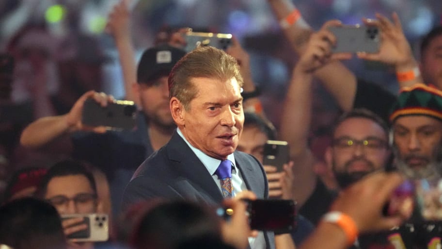 Vince McMahon in a crowd of wrestling fans