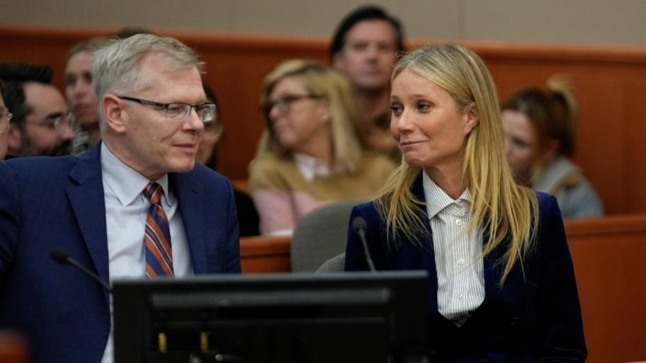 Gwyneth Paltrow and her attorney Steve Owens smile after the reading of the verdict during her trial over her 2016 ski collision.