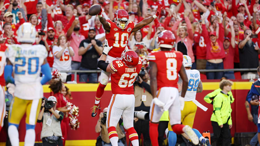 Isiah Pacheco #10 of the Kansas City Chiefs celebrates with Joe Thuney #62 of the Kansas City Chiefs after a touchdown during the fourth quarter against the Los Angeles Chargers