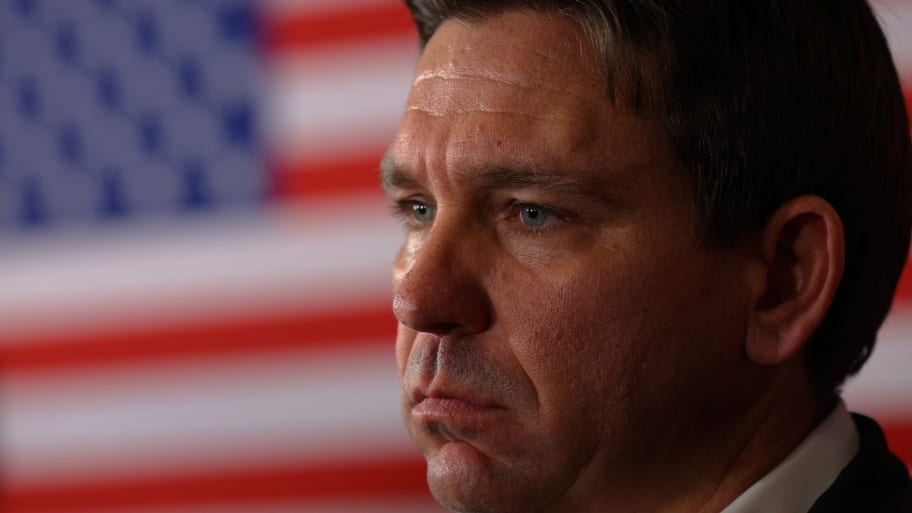 Ron DeSantis stares forward while listening to a question at a New Hampshire campaign event.