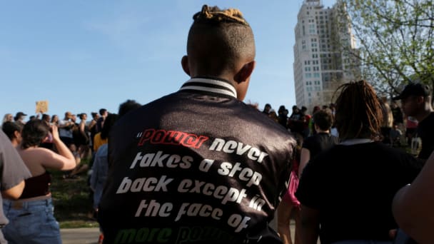 People attend a protest after Black teenager Ralph Yarl was shot and wounded by a homeowner after the boy mistakenly went to the wrong house to pick up his siblings.
