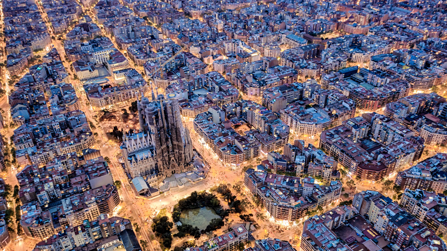 An aerial photograph of Barcelona with Sagrada Familia in the center. 