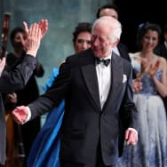 Britain's King Charles reacts as he meets with the cast of a special Gala performance at the Royal Opera House in London.