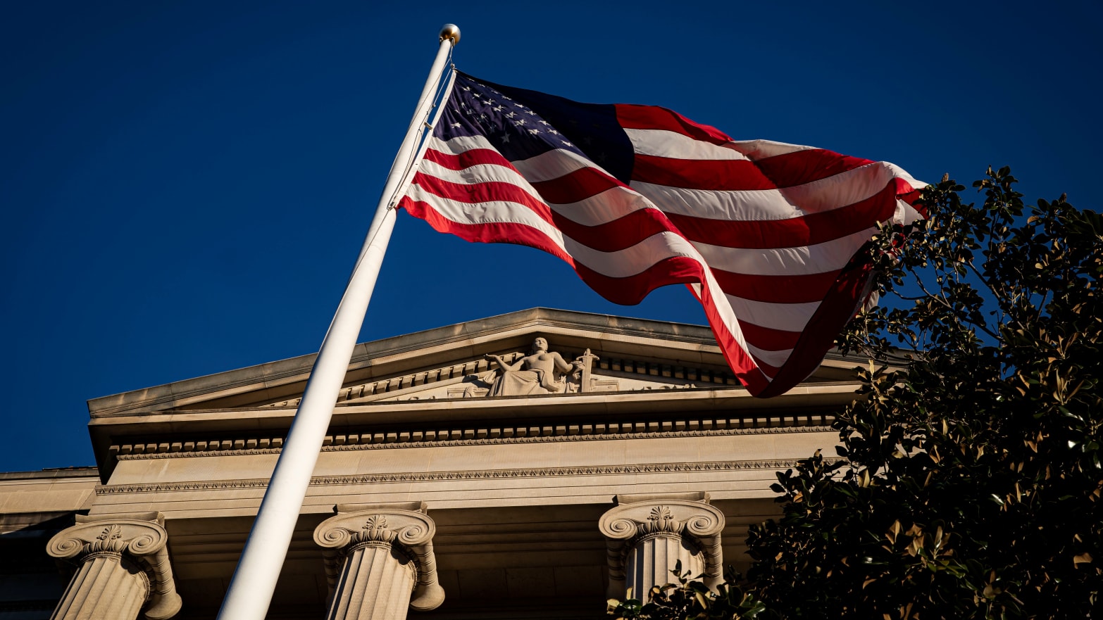 An American flag flies in front of the Department of Justice in Washington, D.C.