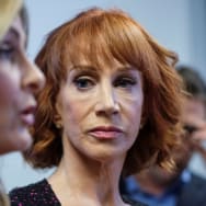 Kathy Griffin watches as her attorney speaks at a news conference