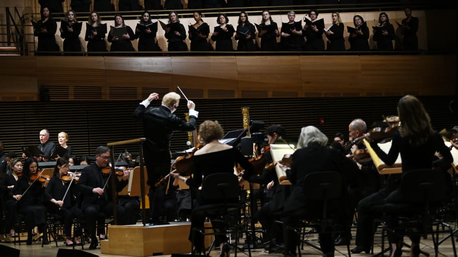 New York Philharmonic, led by Yannick Nézet-Séguin, performs onstage during the Orchestrating Maestro special event at David Geffen Hall at Lincoln Center
