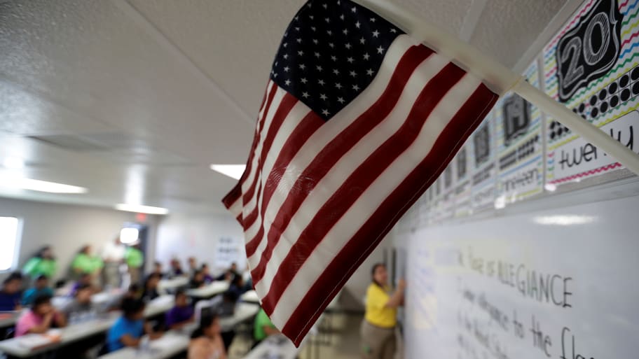 A teacher uses the Pledge of Allegiance in a reading class in Carrizo Springs, Texas, July 9, 2019.