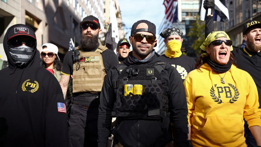 Members of the far-right Proud Boys, including leader Enrique Tarrio (C), rally in support of President Donald Trump to protest against the results of the 2020 U.S. presidential election on Nov. 14, 2020.