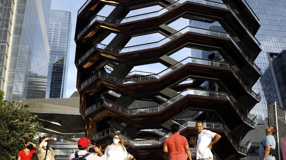 People take photos and look at the "Vessel" in Hudson Yards on August 19, 2021 in New York City.