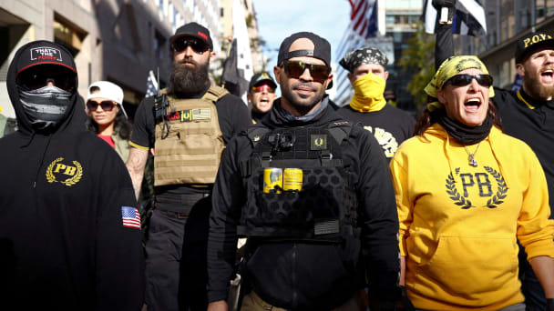 Members of the Proud Boys, including leader Enrique Tarrio, wear group attire