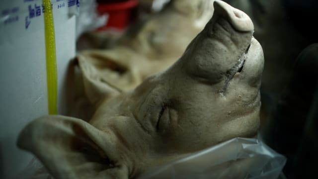 A pig's head is displayed for sale in a local market in Gangneung, South Korea February 14, 2018.