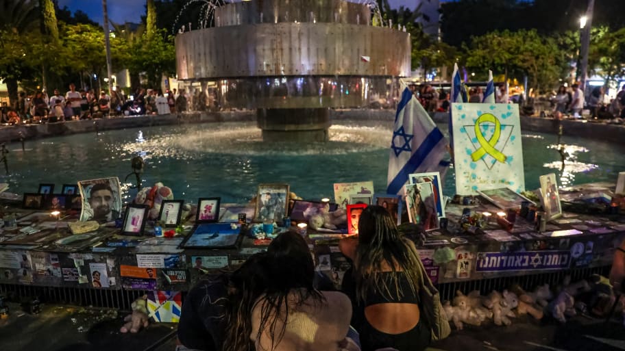 Relatives and friends of the Israeli hostages gather around a memorial set up for the hostages taken by Hamas in Hamedina Square in Tel Aviv, Israel, on May 12, 2024. 
