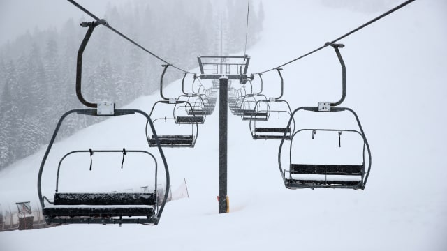 An empty chair lift at Palisades Tahoe ski resort