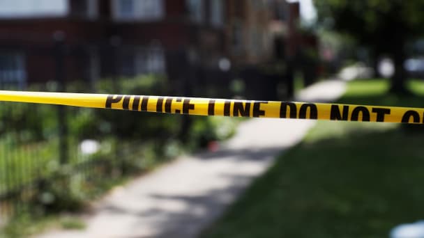 Chicago police crime scene tape is posted at the scene of a gun shooting 