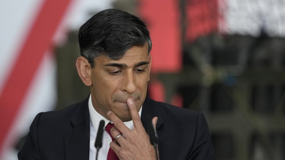 Britain's Prime Minister Rishi Sunak pauses as he addresses a press conference at the Warsaw Armoured Brigade on April 23, 2024 in Warsaw, Poland.