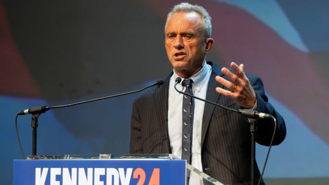 Robert F. Kennedy, Jr. speaks while standing at a podium 