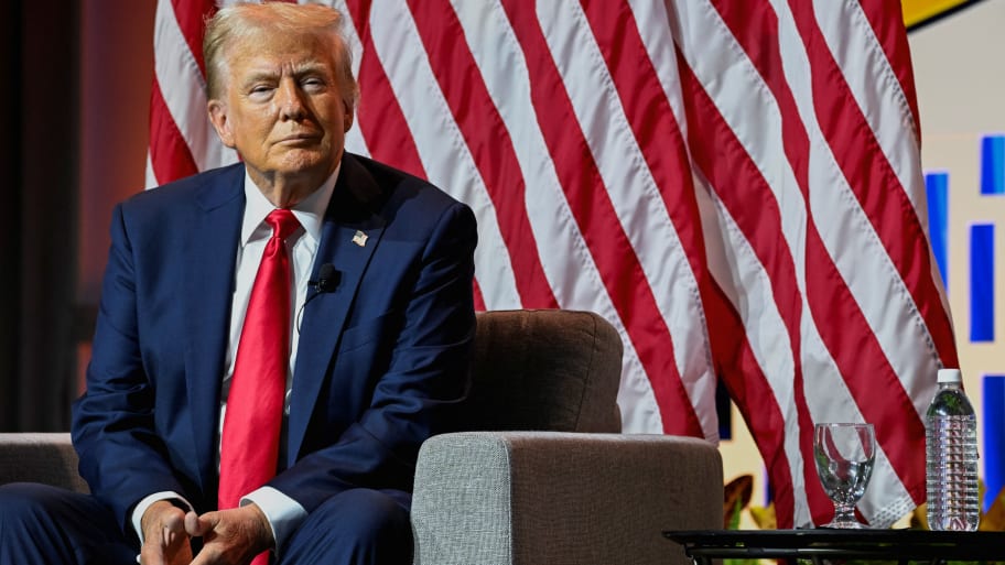 Republican presidential nominee and former U.S. President Donald Trump smiles while speaking on a panel of the National Association of Black Journalists (NABJ) convention in Chicago, Illinois, U.S. July 31, 2024.